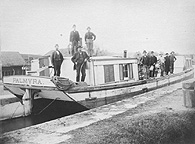 Men on a canal boat on the Erie Canal