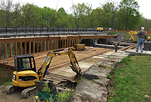 Nine Mile Creek Aqueduct restoration - Bottom timber being swung into place