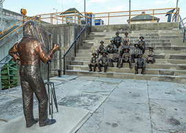 Susan Geissler sculpture  of the Lockport Lock Tenders with photographer